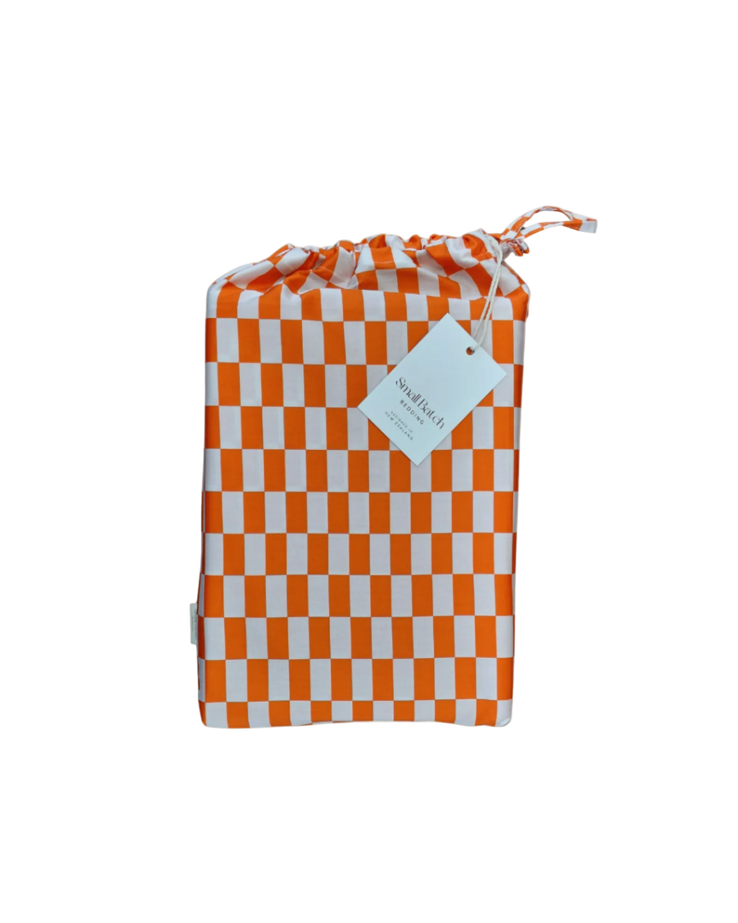 Checkered rectangle red orange protective cotton drawstring bag for fitted sheet with Small Batch Bedding tag on a light background