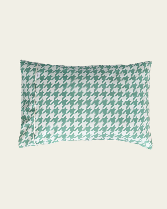 Green and white houndstooth patterned cotton pillow 