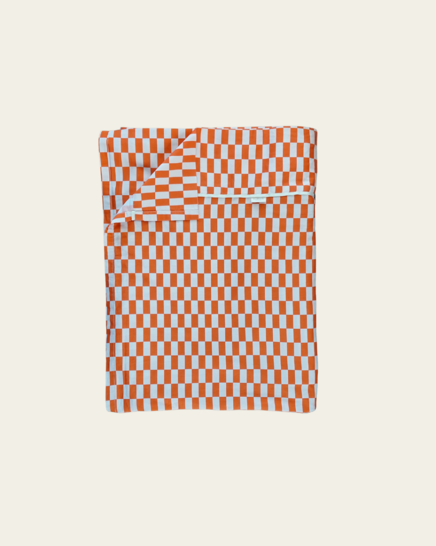 Checkered rectangle tile cotton flat sheet with tomato red orange and light pattern on a beige background
