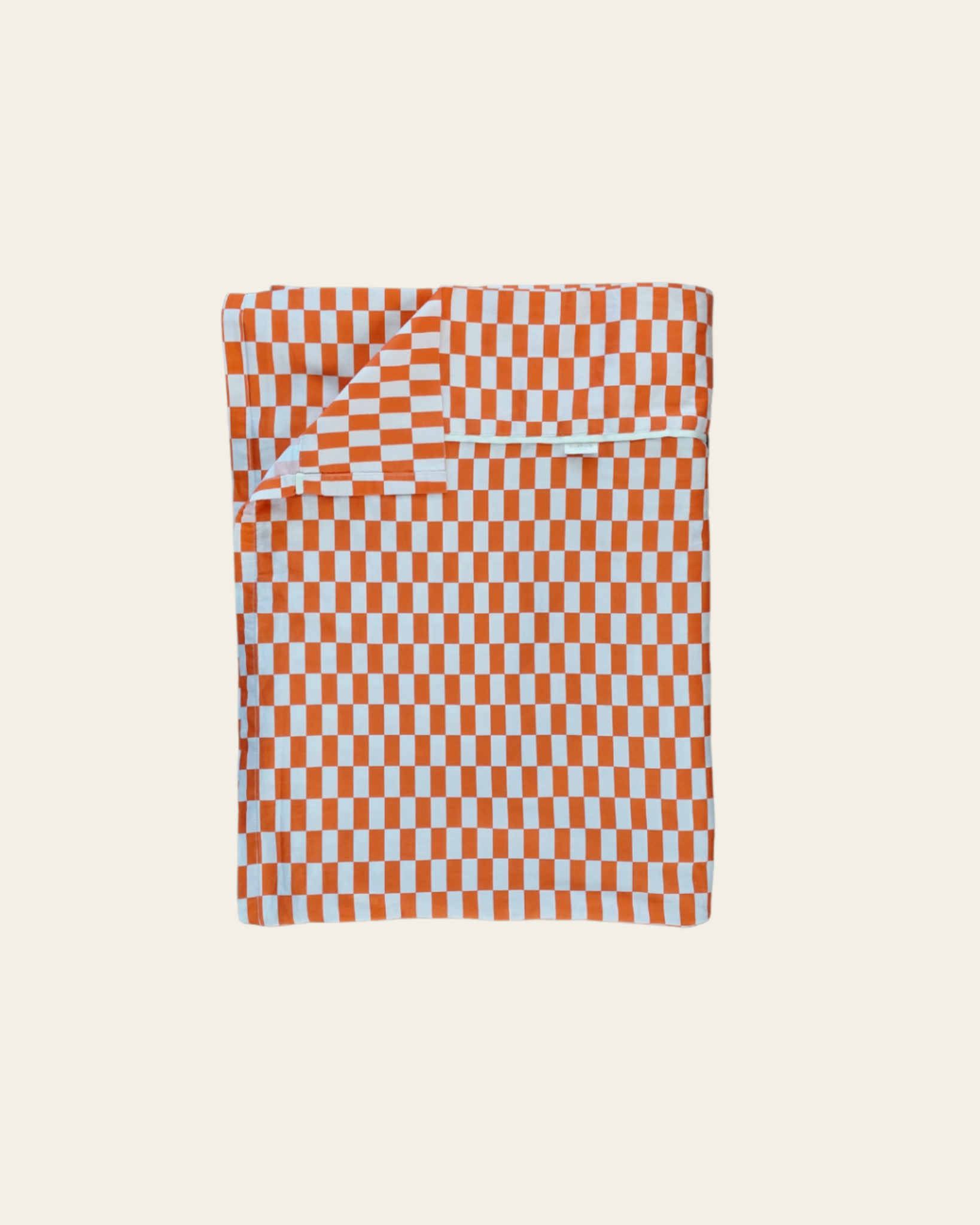 Checkered rectangle tile cotton flat sheet with tomato red orange and light pattern on a beige background